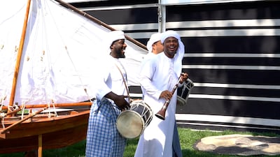 Musicians demonstrate traditional Emirati instruments.