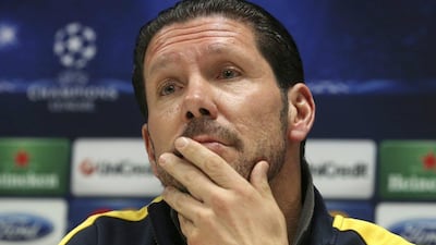 Diego Simeone's Atletico Madrid side are even on points with Barcelona and Real Madrid at the top of La Liga. Antonio Calanni / AP