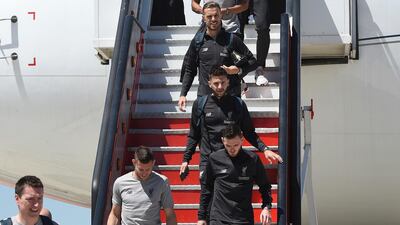 Liverpool players walk off the plane in Madrid. PA Photo