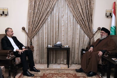 Israel latest strikes on Syria came hours after Iranian Foreign Minister Hossein Amirabollahian, left, met Hezbollah leader Hassan Nasrallah on Friday during a visit to Lebanon. Hezbollah Media Office / AFP