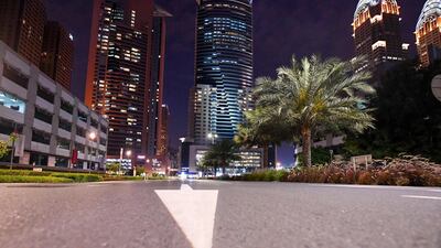 Pedestrian and cycling paths stand empty after people rushed home ahead the curfew. Business Central Towers near Media City can be seen on the right. AFP