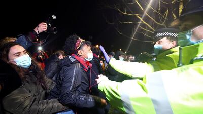 People clash with police during a gathering at a memorial site in Clapham Common bandstand, London. Reuters