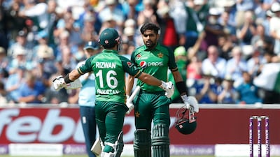 Pakistan's Babar Azam celebrates his century with Mohammad Rizwan.