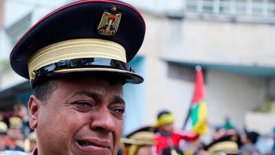 A policeman cries during the funeral of Palestinian policeman Tareq Badwan, shot by Israeli troops during confrontations with demonstrators in the northern West Bank town of Jenin, in his village of Azun. AFP