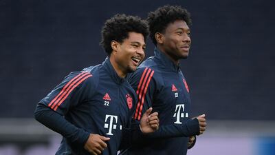 Bayern Munich's German midfielder Serge Gnabry, left, and Bayern Munich's Austrian defender David Alaba take part in a training session at the Tottenham Hotspur Stadium. AFP