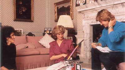 Princess Diana with David and Elizabeth Emanuel, who designed a burqa outfit for her 1986 Gulf tour. Courtesy: RR Auction