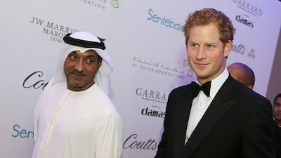 Sheikh Ahmed bin Saeed Al Maktoum (left), chairman of the Emirates Aviation Group walking down the red carpet with Britain's Prince Harry as they arrive at the Sentebale charity evernt Forget-Me-Not Dinner at JW Marriott Marquis Hotel in Dubai. Ali Haider/EPA