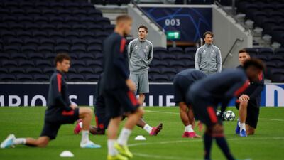 Bayern Munich coach Niko Kovac and assistant coach analytics Danny Rohl observe players during training. Reuters