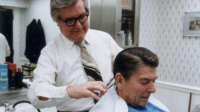 US president Ronald Reagan gets his hair trimmed in the White House, in January 1981. Getty Images
