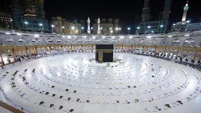 Worshippers perform the evening taraweeh prayer during Ramadan around the Kaaba in the Grand Mosque complex in Makkah. Saudi authorities said on April 5 only people immunised against Covid-19 will be allowed to perform the year-round Umrah pilgrimage from the start of Ramadan, the fasting month for Muslims. AFP