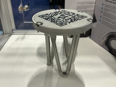 The magnetic docking system invented by Astroscale at the 2024 Space Comm Expo. The idea is to fit the plate to a satellite so it can be docked with an Astroscale spacecraft at the end of its life. Matthew Davies / The National