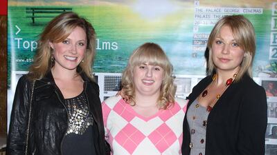 From left, Kate Jenkins, Rebel Wilson – wearing a black skirt and Pringle-style jumper – and Marney McQueen arrive at the St Kilda Film Festival opening night on May 26, 2009 in Melbourne, Australia. Getty Images