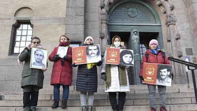 People demonstrate in November 2021 outside the Stockholm District Court, where Iranian former prison official Hamid Noury was questioned before being put on trial for alleged war crimes. TT News Agency / AFP