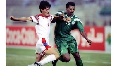 Saeed Owairan, of Saudi Arabia, right, is challenged by Gyongil Kim, of North Korea, during their 1993 World Cup qualifying match. Shaun Botterill / Allsport