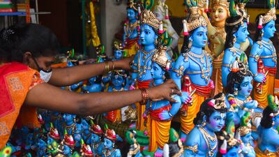 A vendor arranges idols of Krishna in Chennai, India. EPA
