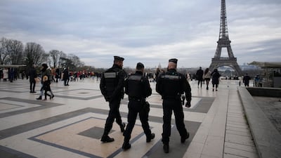 French police officers patrol the Trocadero Plaza near the Eiffel Tower after a man attacked passers-by on Saturday evening. AP