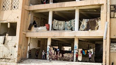 A view of a damaged building housing internally displaced Syrians from Deir Ezzor in Syria's northern city of Raqqa.