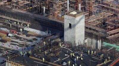 Two of the four concrete towers that will hold the museum's iconic dome. Silvia Razgova / The National