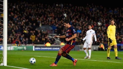 Luis Suarez of Barcelona taps in his team’s opening goal against AS Roma on Tuesday in the Champions League. David Ramos / Getty Images