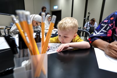 Emirati artist Abdullah Lutfi conducts an art workshop as part of the programme. Victor Besa / The National