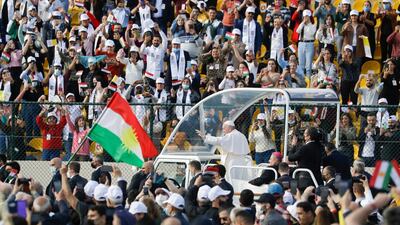Pope Francis arrives on the popemobile to celebrate Mass at the Franso Hariri Stadium in Erbil. AP Photo
