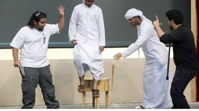 From left, the students Ali Atef, Ammar Al Hilali, Abdullah Mohammed and Malek Ali dramatise the theory of gravity in a training session at UAE University yesterday.