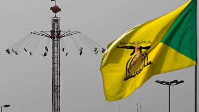The flag of Kataib Hezbollah flies in Baghdad in March. AFP