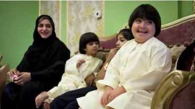 Dhahi with his sister Afifa, brother Nahayan and their mother Wadha at their home.