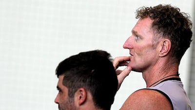 Dougie Brown, right, conceded the UAE players were feeling a little flat after the result. Satish Kumar for The National