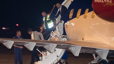 Mr Mossaheb and Mr Ghaderi exit the plane. AFP
