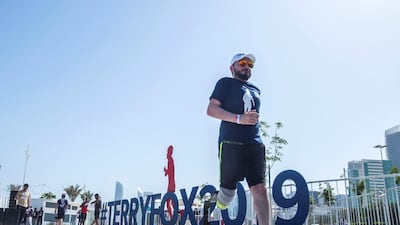 Runner Tareq, who lost his legs during an accident, pounds the streets on Friday.
