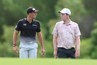 Viktor Hovland of Norway, left, and Robert MacIntyre of Scotland walk on the third hole during Day Two of the DP World Tour Championship on the Earth Course at Jumeirah Golf Estates. Getty Images