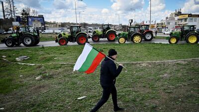 A Bulgarian farmer at a protest to stop trucks carrying Ukrainian grain from crossing the Danube Bridge between Bulgaria and Romania. AFP