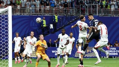 Argentina's Lautaro Martinez heads home their second goal. Reuters