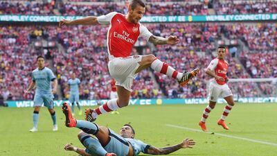 Arsenal’s Calum Chambers, top, vies for the ball with Manchester City’s Aleksander Kolarov during the FA Community Shield at Wembley Stadium in London, Britain, 10 August 2014. EPA/ANDY RAIN