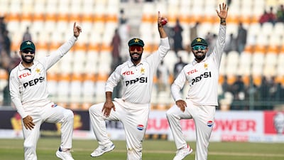 Pakistan's Sajid Khan, centre, Mohammad Rizwan, left, and Babar Azam celebrate victory over the West Indies in the first Test in Multan. AFP
