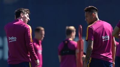 Barcelona’s Argentinian forward Lionel Messi (L) and Barcelona’s Brazilian forward Neymar take part in a training session at the FC Barcelona Joan Gamper Sports Centre in Sant Joan Despi, near Barcelona on April 16, 2015, on the eve of the Spanish League match FC Barcelona v Valencia CF. AFP / LLUIS GENE