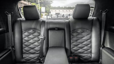 The seat belts are colour-coded. Kahn Design