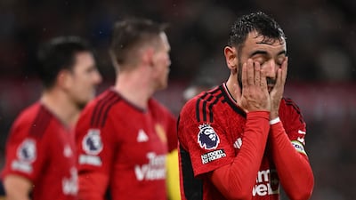 Manchester United's Portuguese midfielder #08 Bruno Fernandes (R) reacts during the English Premier League football match between Manchester United and Bournemouth at Old Trafford in Manchester, north west England, on December 9, 2023. (Photo by Oli SCARFF / AFP) / RESTRICTED TO EDITORIAL USE. No use with unauthorized audio, video, data, fixture lists, club/league logos or 'live' services. Online in-match use limited to 120 images. An additional 40 images may be used in extra time. No video emulation. Social media in-match use limited to 120 images. An additional 40 images may be used in extra time. No use in betting publications, games or single club/league/player publications. /