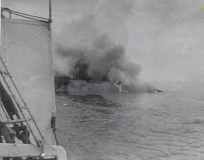 Seen from the deck of a salvage tug, the burnt out Dara sinks under tow to Dubai in April 1961. At least 240 people are believed to have died when a terrorist bomb caused a disastrous fire during a storm. UK National Archives