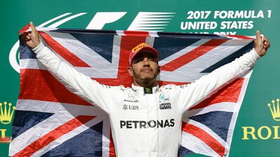 Mercedes driver Lewis Hamilton celebrates after winning the Formula One United States Grand Prix at the Circuit of the Americas. Darron Cummings / AP Photo