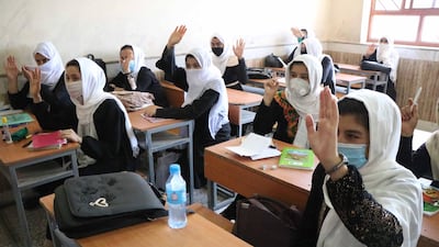 Afghan girls attend the second day of classes after schools opened in Herat, Afghanistan, August 23, 2020. EPA