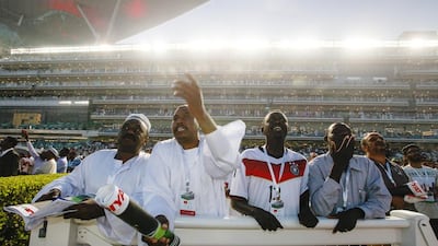 Racegoers cheer during Dubai World Cup at Meydan Racecourse in Dubai, March 28, 2015. (Photo by: Sarah Dea/The National)