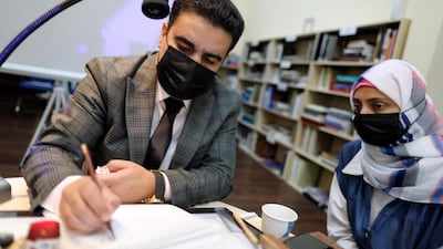 Shaher Al Taref, an instructor and calligraphist at the Sharjah Department of Culture, teaches the traditional writing styles.