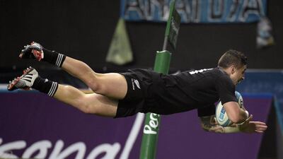 New Zealand's All Blacks'scrum half TJ Perenara dives to score the team's fourth try against Argentina on Saturday as they won the Rugby Championship. Juan Mabromata / AFP / September 27, 2014