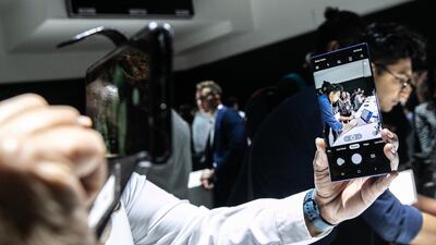 An attendee demonstrates the camera function on a Samsung Galaxy Note 10 device. Bloomberg
