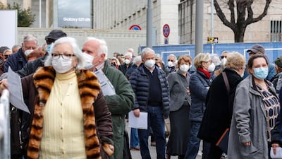 People line up to get the AstraZeneca vaccine outside La Nuvola convention centre in Rome, Italy on Friday. EU member countries reintroduced the AstraZeneca Covid-19 vaccine in their inoculation campaigns. EPA