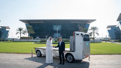 Mohsen Ahmad, chief executive of Dubai South's Logistics District, and Andrey Bolshakov, founding chief executive of Evocargo, with the driverless EVO.1 truck. Photo: Dubai Media Office