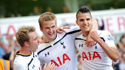 Tottenham Hotspur defender Eric Dier, centre, celebrates scoring their second goal against Queens Park Rangers. AFP