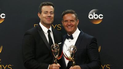 Mark Burnett and host Carson Daly pose backstage with their award for Outstanding Reality-Competition Program for The Voice. Reuters